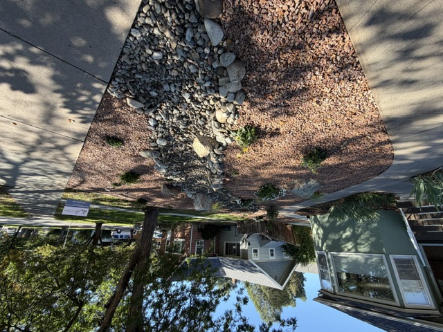 Long view along the dry creek toward the home