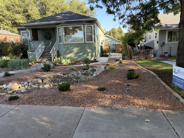 Completed front-yard landscape viewed from the sidewalk