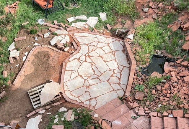 Overhead view of stone patio installation in progress